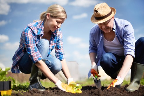 Protective equipment laid out for gardeners including gloves and boots