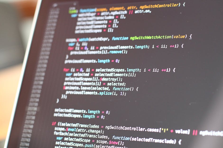 A close-up view of a computer screen displaying colorful lines of code in a text editor, with a focus on the various syntax highlighting styles including pink, green, blue, and white. The background i